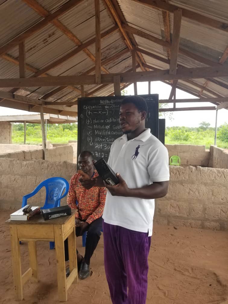 Thomas speaking and holding his Proclaimer Audio Bible